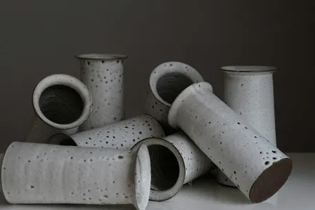 Hand-thrown ceramic pottery on a shelf